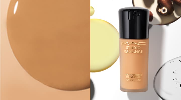 Model's hand holding MAC Cosmetics Studio Radiance Foundation. Swatch samples of various shades of foundation.